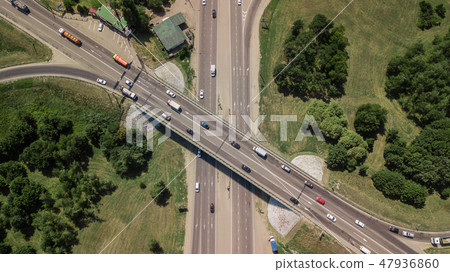 Aerial view of highway and overpass in city on a cloudy day Aerial view of highway and overpass in city on a cloudy day 47936860