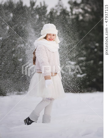 little happy beautiful girl in winter forest 47937115