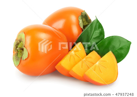 Persimmon fruit with leaves isolated on white background close-up Persimmon fruit with leaves isolated on white background close-up 47937248