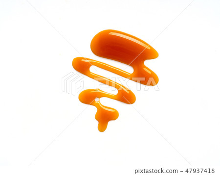 sweet caramel sauce isolated on white 47937418