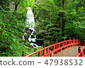 Waterfall and red bridge 47938532