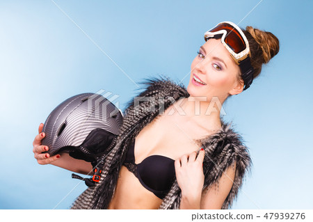 Nice lady having fun with winter accessories. Nice lady having fun with winter accessories. 47939276