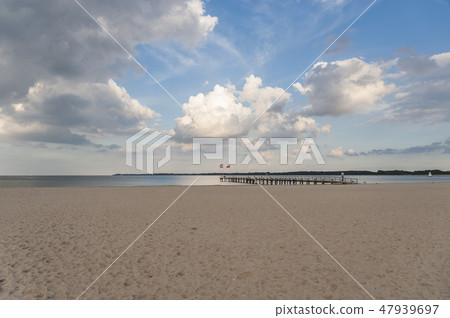 Beach and pier in Travemuende Beach and pier in Travemuende 47939697