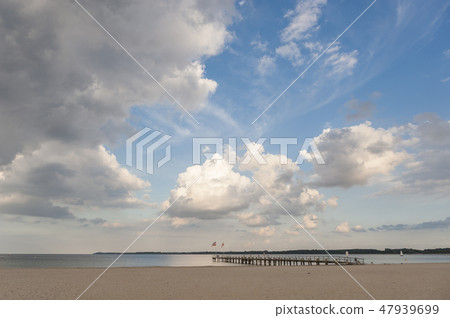 Beach and pier in Travemuende Beach and pier in Travemuende 47939699
