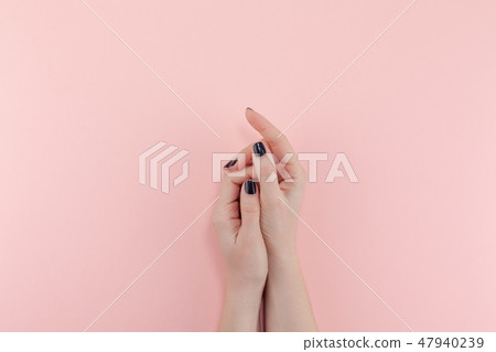 Woman's hands with black manicure Woman's hands with black manicure 47940239