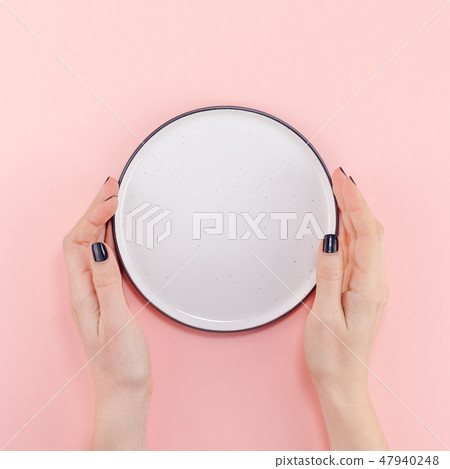 Empty plate in female hands mockup Empty plate in female hands mockup 47940248