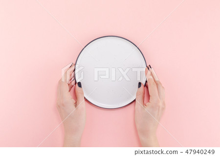 Empty plate in female hands mockup Empty plate in female hands mockup 47940249