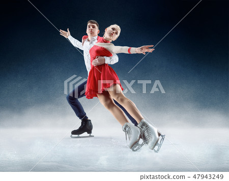 Professional man and woman figure skaters performing on ice show Professional man and woman figure skaters performing on ice show 47943249