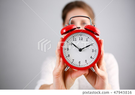 Adult smiling caucasian woman hold red Adult smiling caucasian woman hold red 47943816