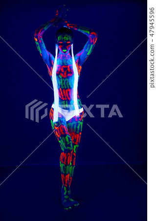 Slim girl with UV bodyart full-length shot Slim girl with UV bodyart full-length shot 47945596
