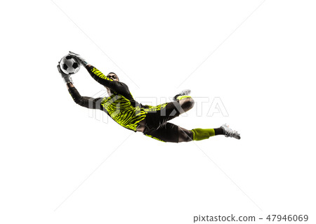 One soccer player goalkeeper man catching ball One soccer player goalkeeper man catching ball 47946069