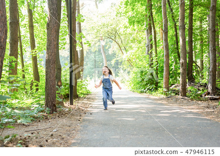 Children, childhood and nature concept - Portrait of beautiful small child girl running through the Children, childhood and nature concept - Portrait of beautiful small child girl running through the 47946115