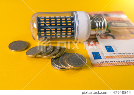 Led Light Bulb and european banknotes and coins Led Light Bulb and european banknotes and coins 47948844