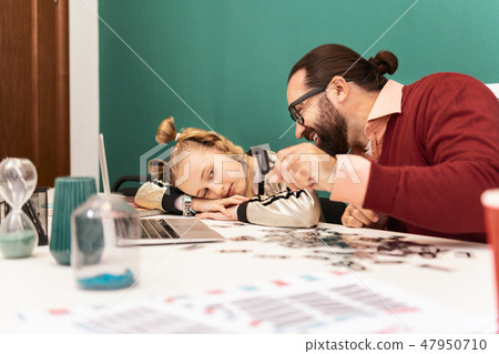 Pretty fair-haired girl with bracelets on her hand feeling tired 47950710