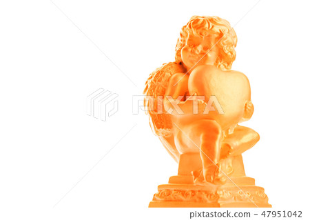 Golden Cherub statue with red heart on an isolated white background. Angel holding a heart of love Golden Cherub statue with red heart on an isolated white background. Angel holding a heart of love 47951042
