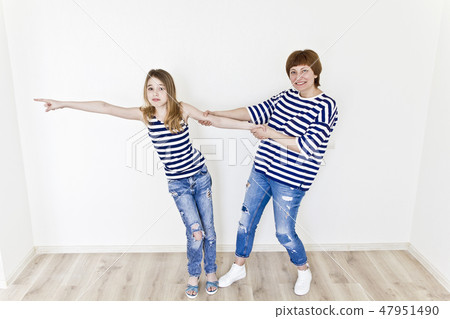 Beautiful mother and daughter on white 47951490