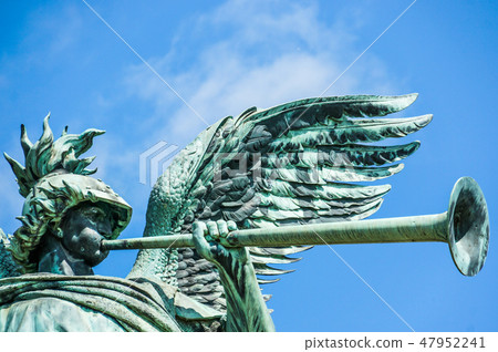 Angel statue playing the trumpet  47952241