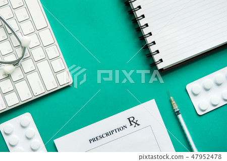 Top view of medical equipment on green background 47952478