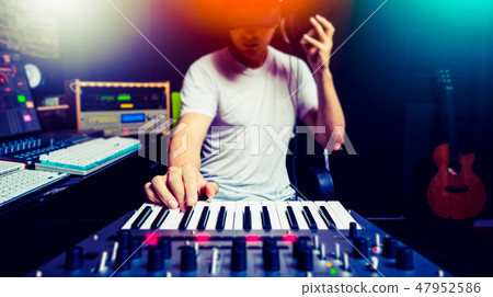 music producer, dj making music in home studio 47952586