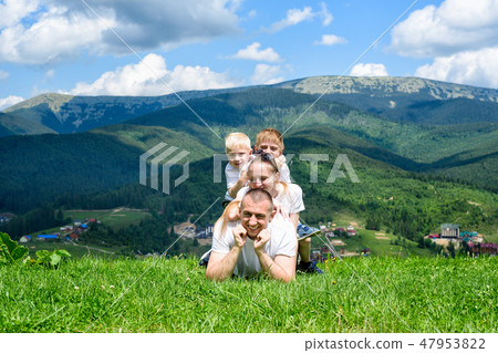 Happy family: joyful father, mother and two sons Happy family: joyful father, mother and two sons 47953822