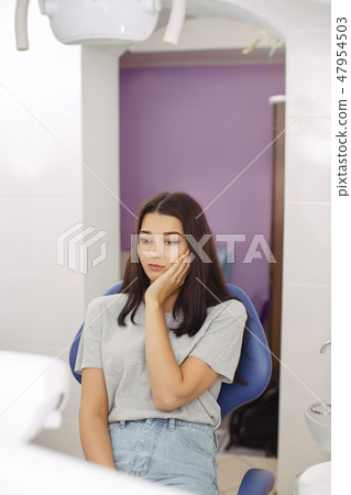 Young woman suffering from toothache Young woman suffering from toothache 47954503