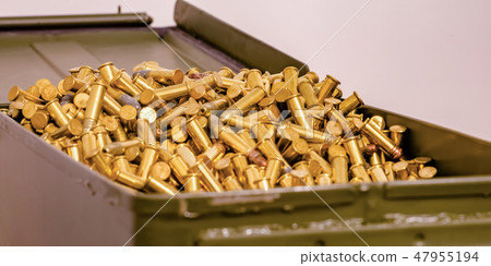 Open metal box full of shiny golden bullets Open metal box full of shiny golden bullets 47955194
