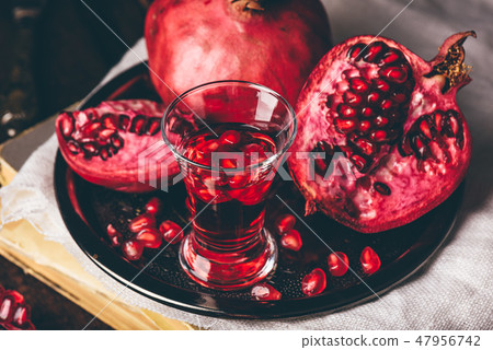 Cocktail with pomegranate fruit Cocktail with pomegranate fruit 47956742