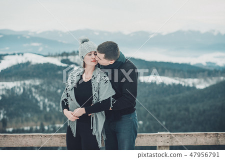 Loving couple hugging at the top of the mountain in the Ukrainian Carpathians 47956791