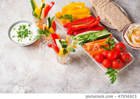 Healthy snacks. Vegetables and hummus Healthy snacks. Vegetables and hummus 47956923