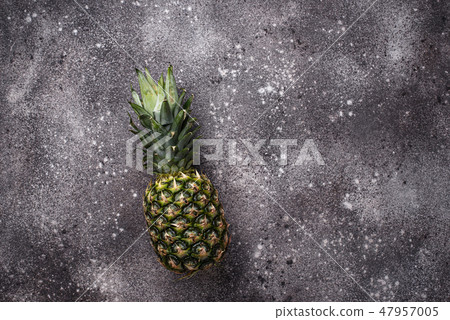Pineapple on gray concrete background Pineapple on gray concrete background 47957005