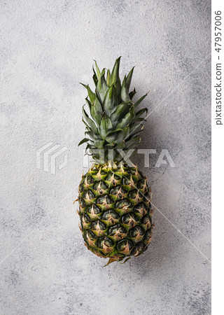 Pineapple on gray concrete background Pineapple on gray concrete background 47957006