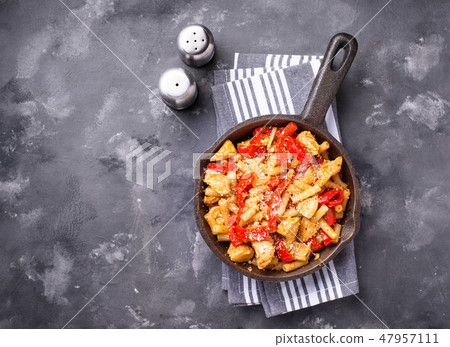Pasta with chicken and pepper in tomato sauce Pasta with chicken and pepper in tomato sauce 47957111