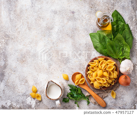 Ingredients for cooking  pasta with spinach  47957127