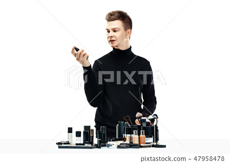 Professional makeup artist isolated on white 47958478