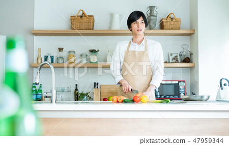 Men cooking in the kitchen Men cooking in the kitchen 47959344