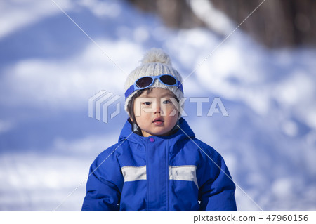 Children playing in the snow 47960156