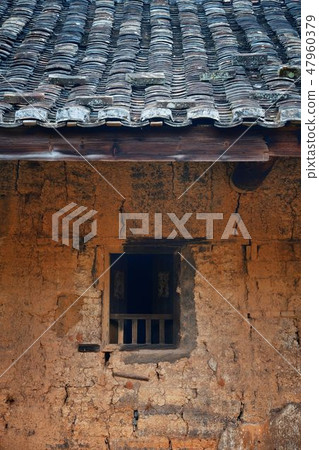 Fujian Tulou building window closeup 47960379