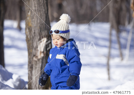 Children playing in the snow Children playing in the snow 47961775