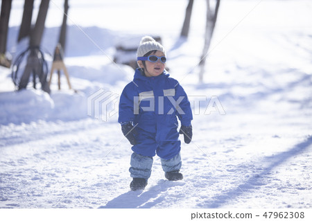Children playing in the snow 47962308