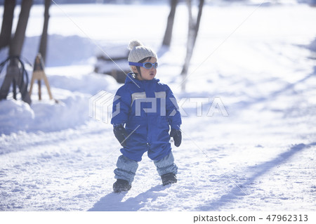 Children playing in the snow 47962313
