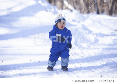 Children playing in the snow 47962324