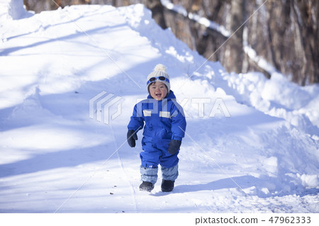 Children playing in the snow 47962333
