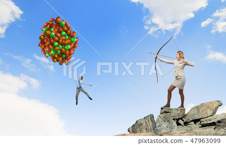 Woman aiming her goal Woman aiming her goal 47963099