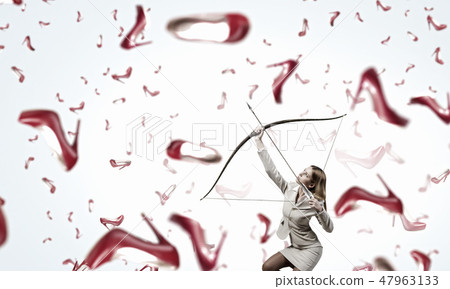Woman aiming her goal Woman aiming her goal 47963133
