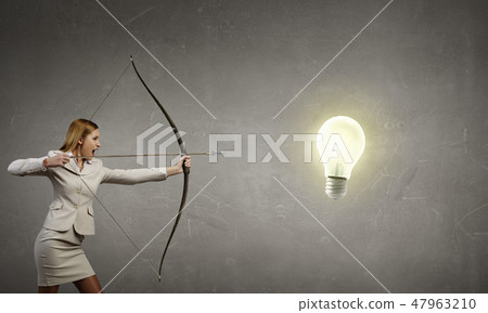 Woman aiming her goal Woman aiming her goal 47963210