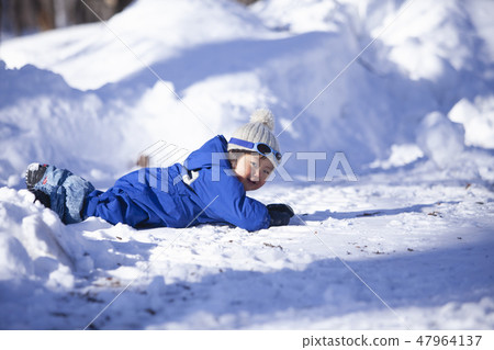 Children playing in the snow 47964137