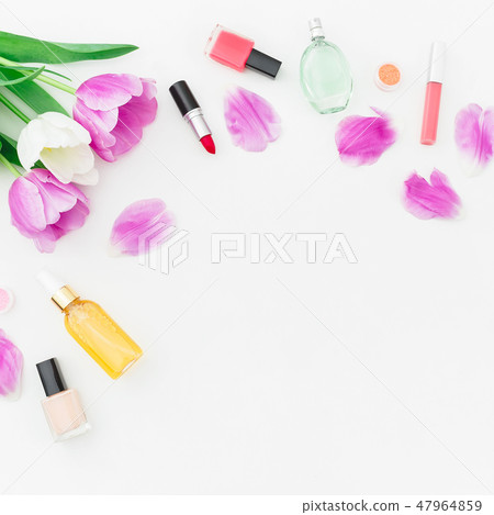 Frame of tulips flowers and cosmetics, lipstick 47964859