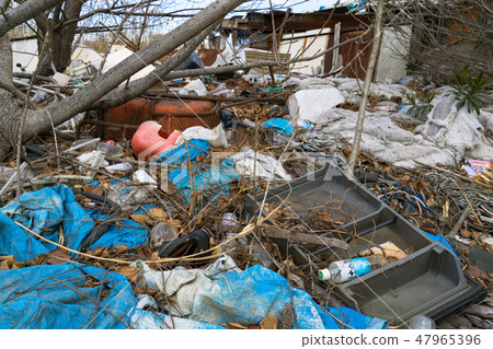 Illegal dumping of garbage and abandoned shops 47965396