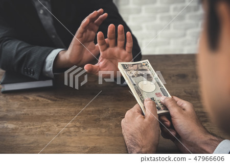 Businessman rejecting money from his partner 47966606