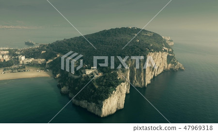 Aerial view of the Montagna Spaccata or Broken Mountain, a sharply vertical cliff, in Gaeta, Italy 47969318